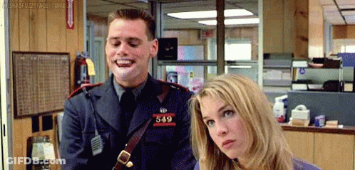 A Man In A Police Uniform Is Laughing While Standing Next To A Woman In A Room . GIF