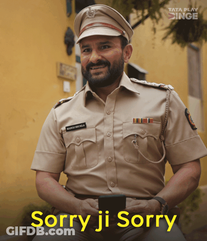 A Man In A Police Uniform Is Smiling With The Words Sorry Ji Sorry Above Him GIF