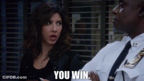 A Man In A Police Uniform Is Talking To A Woman Who Is Holding A Cell Phone . GIF