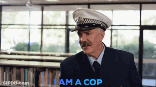 A Man In A Police Uniform Says I Am A Cop In Blue GIF