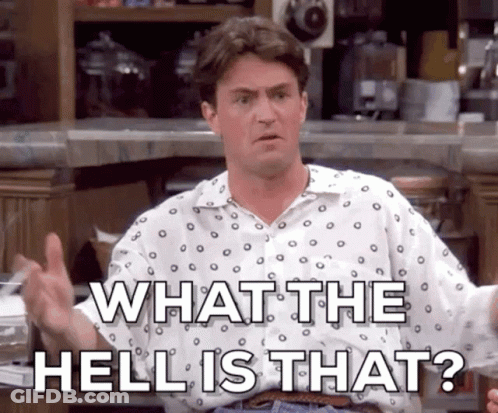 A Man In A Polka Dot Shirt Is Giving A Thumbs Up And Says What The Hell Is That ? GIF