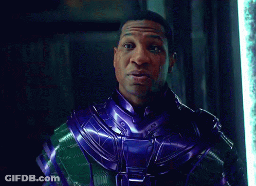 A Man In A Purple And Green Costume Says Time GIF