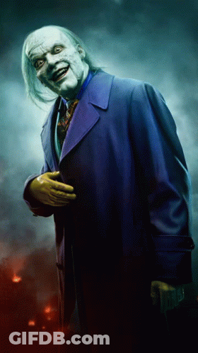 A Man In A Purple Coat And Yellow Gloves GIF