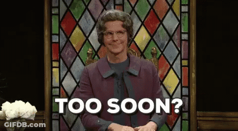 A Man In A Purple Coat Is Sitting In Front Of A Stained Glass Window And Says Too Soon . GIF