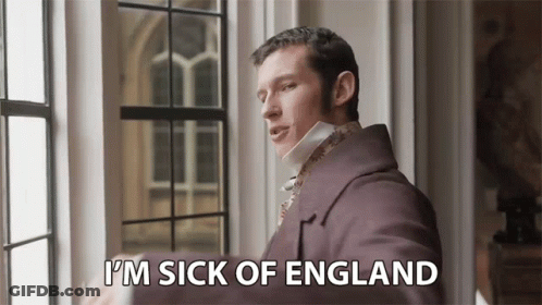 A Man In A Purple Coat Is Standing Next To A Window And Saying `` I 'M Sick Of England '' GIF