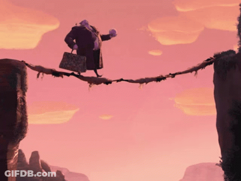 A Man In A Purple Coat Is Walking Across A Bridge GIF