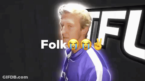 A Man In A Purple Jacket Is Crying With The Word Folk Behind Him GIF