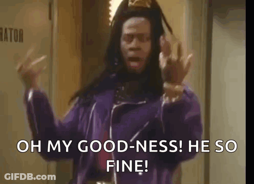 A Man In A Purple Jacket Is Standing In A Hallway And Says `` Oh My Goodness He So Fine '' GIF
