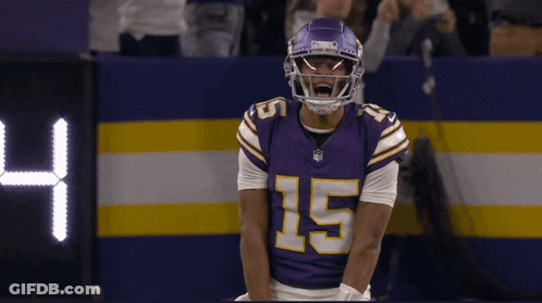 A Man In A Purple Jersey With The Number 15 On It GIF