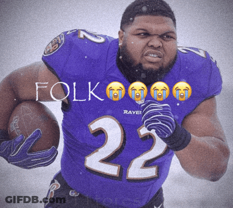 A Man In A Purple Jersey With The Number 22 Holding A Football GIF