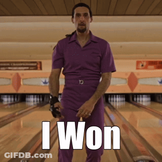 A Man In A Purple Jumpsuit Is Standing In A Bowling Alley With The Words I Won Above Him GIF