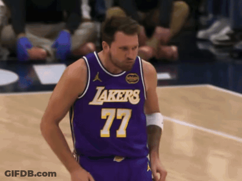 A Man In A Purple Lakers Jersey Stands On The Court GIF