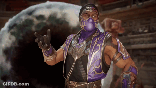 A Man In A Purple Mask And Armor Is Giving The Middle Finger GIF