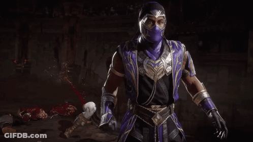 A Man In A Purple Mask Is Holding A Crystal Ball In His Hands . GIF