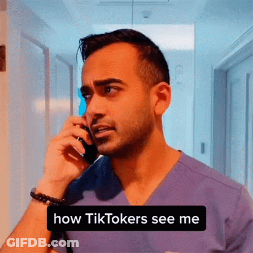 A Man In A Purple Scrub Is Talking On A Cell Phone And Says " How Tiktokers See Me " GIF