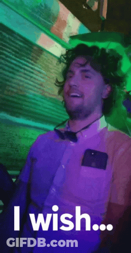 A Man In A Purple Shirt And Bow Tie Is Saying `` I Wish ... '' GIF