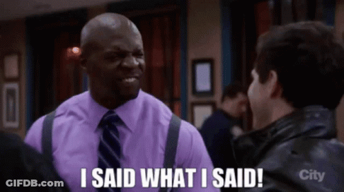 A Man In A Purple Shirt And Tie Says " I Said What I Said " To Another Man GIF