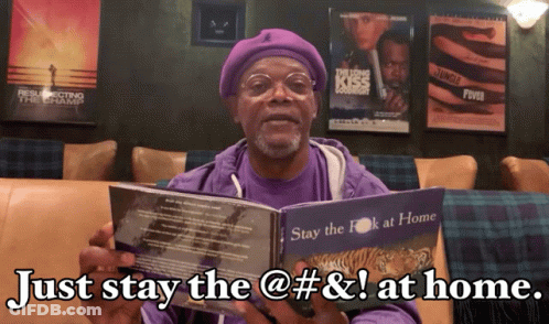 A Man In A Purple Shirt Holds A Book That Says Just Stay The @ # & ! At Home GIF