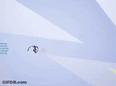 A Man In A Purple Shirt Is Flying Through The Air GIF