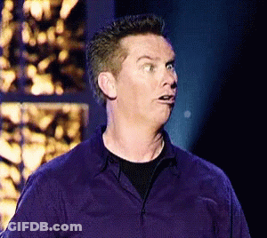 A Man In A Purple Shirt Is Making A Face GIF