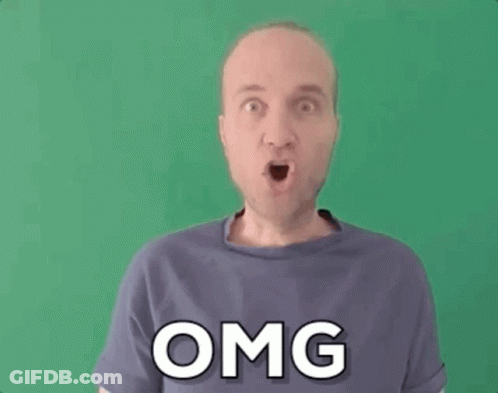 A Man In A Purple Shirt Is Making A Funny Face And The Word Omg Is On His Shirt . GIF