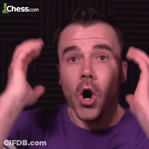 A Man In A Purple Shirt Is Making A Surprised Face With Chess.com In The Background GIF
