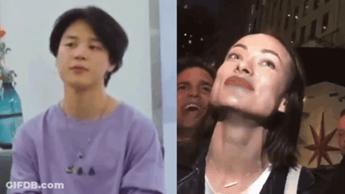 A Man In A Purple Shirt Is Next To A Woman In A White Shirt GIF