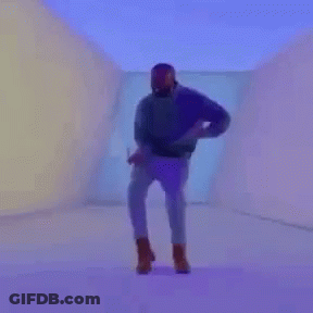 A Man In A Purple Shirt Is Playing Tennis On A Tennis Court GIF