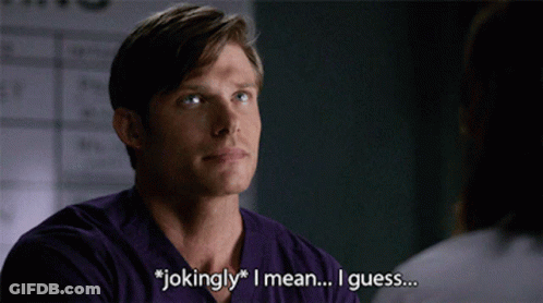 Man In Purple Shirt Saying Jokingly To Woman GIF