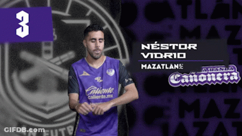 A Man In A Purple Shirt With The Number 3 On The Bottom GIF