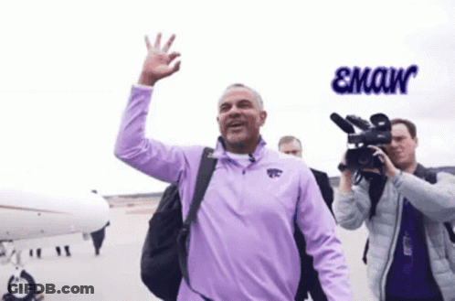 A Man In A Purple Shirt With The Word Emaw On The Bottom Right GIF