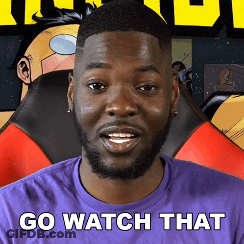 A Man In A Purple Shirt With The Words Go Watch That Written On It GIF