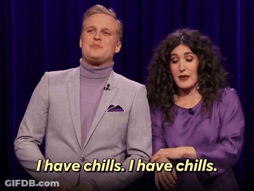 A Man In A Purple Suit And A Woman In A Purple Dress Say I Have Chills GIF