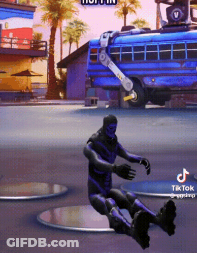 A Man In A Purple Suit Is Sitting In Front Of A Blue Bus GIF