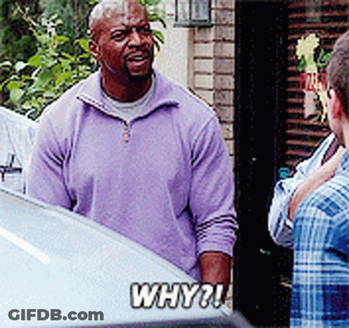 A Man In A Purple Sweater Is Talking To A Man In A Plaid Shirt GIF