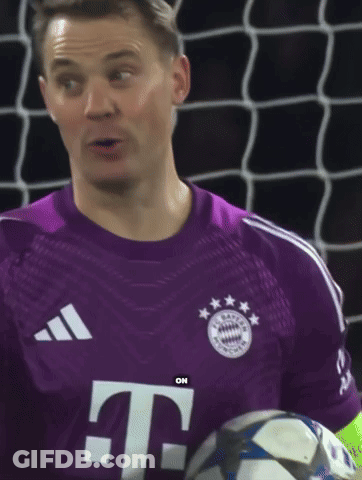 A Man In A Purple T-Mobile Jersey Is Holding A Soccer Ball GIF