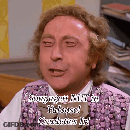 A Man In A Purple Vest And Bow Tie Says Souyugett Nut In Yuloose Goudettes Ir GIF