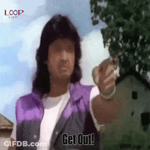 A Man In A Purple Vest Says " Get Out " While Pointing At Something GIF