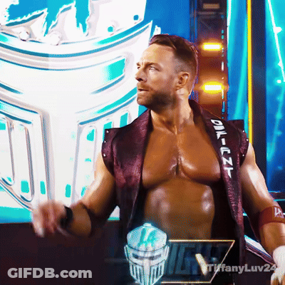 A Man In A Purple Vest With The Word Oil On The Sleeve GIF