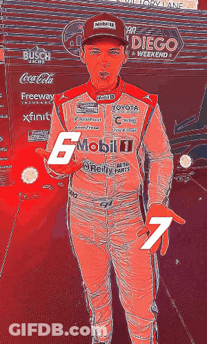 A Man In A Racing Suit Has The Number 7 On His Hand GIF