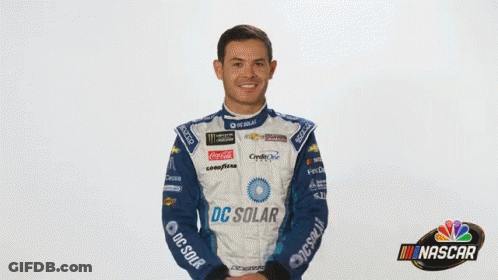A Man In A Racing Suit With Dc Solar On It GIF