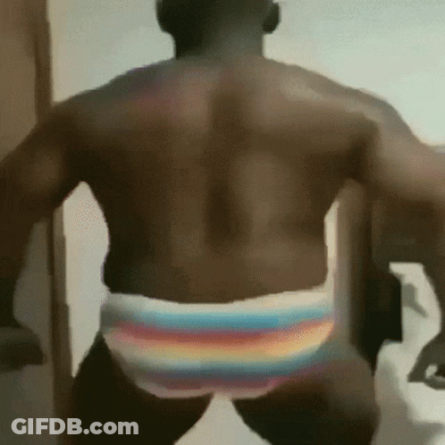 Man In Rainbow Striped Underwear Standing GIF