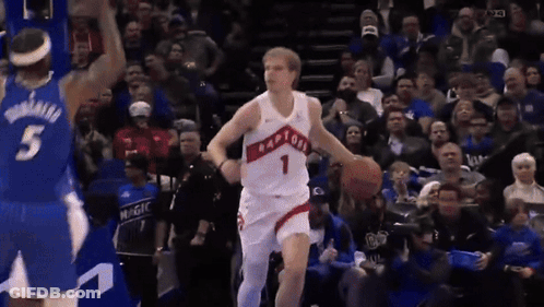 A Man In A Raptors Jersey Dribbles A Basketball GIF
