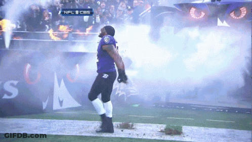 A Man In A Ravens Uniform Is Walking On A Field GIF