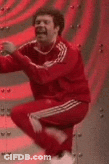 A Man In A Red Adidas Tracksuit Is Dancing . GIF