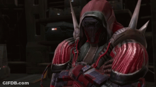 A Man In A Red And Black Armor With A Hood On His Head GIF