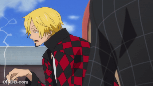 A Man In A Red And Black Checkered Jacket Smoking A Cigarette GIF