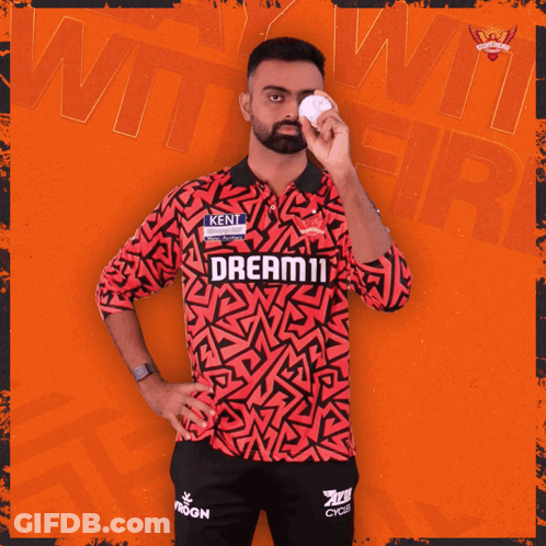A Man In A Red And Black Shirt That Says Dream11 On It GIF