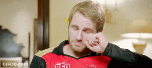 A Man In A Red And Black Shirt With The Word Red On It GIF