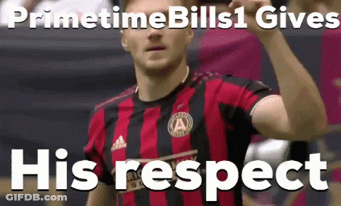 A Man In A Red And Black Striped Shirt With The Words Primetime Bills 1 Gives His Respect Behind Him GIF